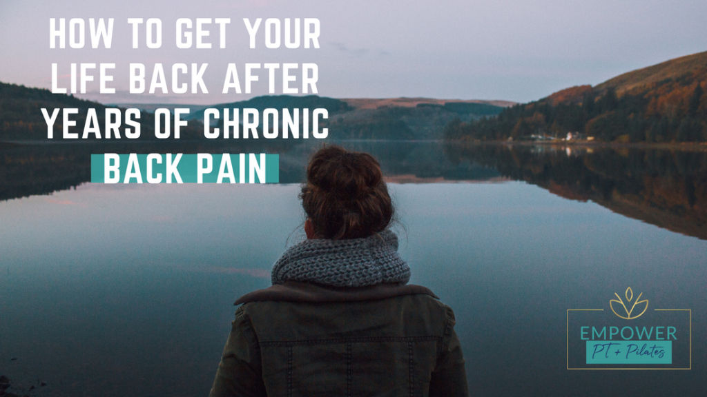 A woman looking upon a lake wondering how to get her life back from years of chronic back pain. 